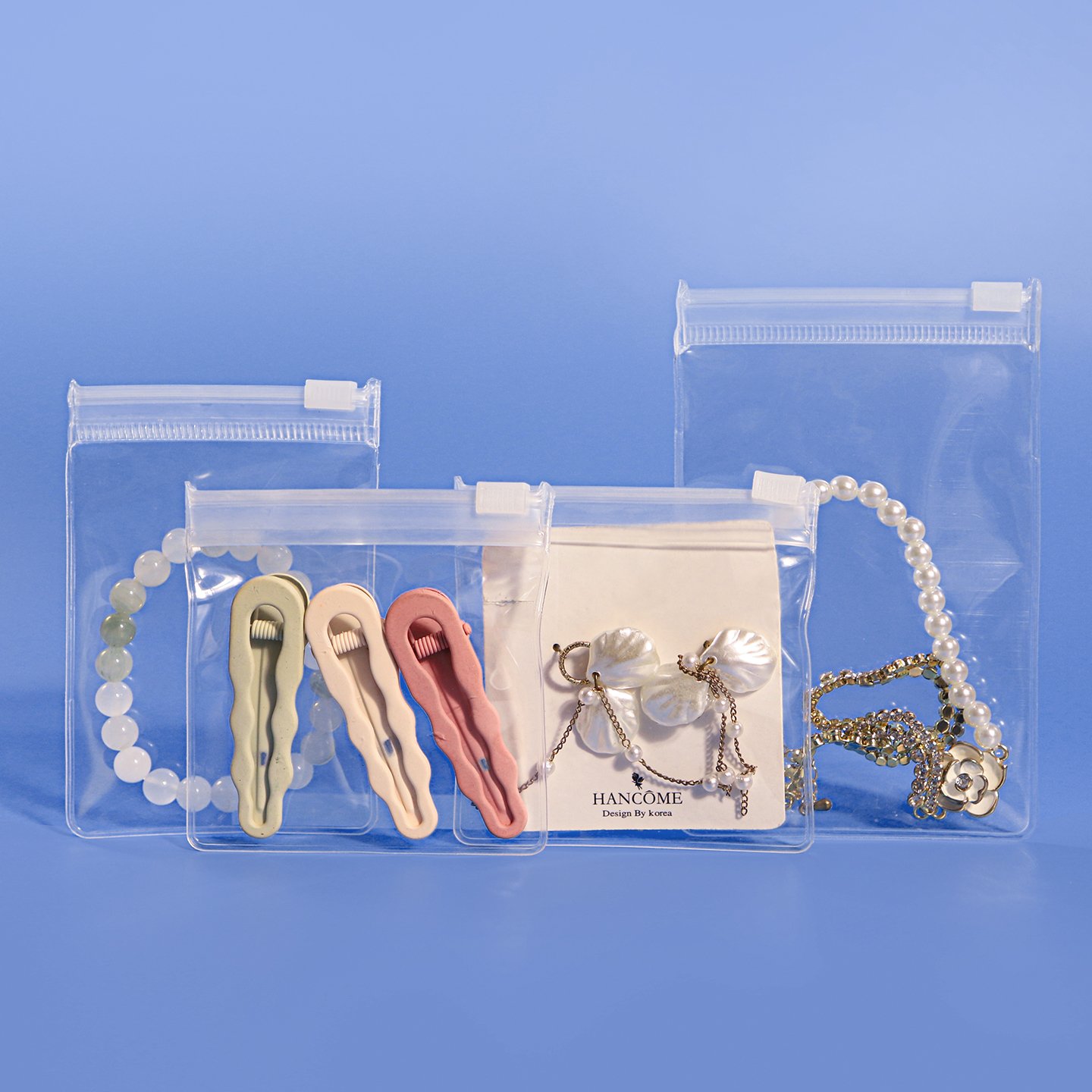 Clear EVA zipper bags with white slider closures for jewelry, hair clips and small accessories